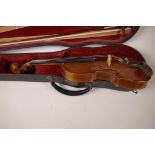 A small violin, 22½" long, with bow, in associated case