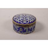 An Islamic enamel trinket box, decorated with Islamic script, 3" diameter