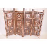 A Moorish four panel screen, with pierced and bone inlay decoration, each panel 48" x 15"