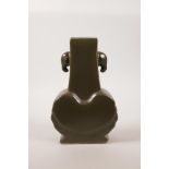 A Chinese tea dust glazed porcelain vase with two elephant head handles, 6 character mark to base,