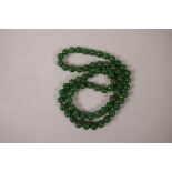 A long string of jade beads, 30" long