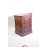 A William IV rosewood Davenport, with leather inset sliding top, four true and four false drawers,