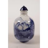A Chinese blue and white porcelain snuff bottle with landscape decoration, leaf mark to base, 2½"