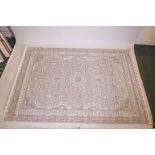 A grey gound woven silk rug with traditional shabaz medallion design, 62½" x 94"