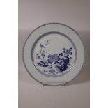 A C19th Chinese blue and white porcelain charger decorated with a bird and rabbit amongst