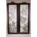A pair of Chinese famille verte porcelain panels decorated with mountain landscapes, mounted in