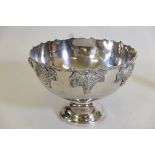 A silver plated punch bowl with applied grape and vine decoration, 15" diameter x 10½" high