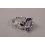 A 925 silver lady's dress ring set with a large oval amethyst, approximate size 'Q'