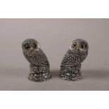 A pair of novelty silver plated condiments in the form of owls, 2" high