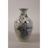 A Chinese polychrome porcelain vase decorated with ladies in a landscape, seal mark to base, 7" high
