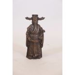 A Chinese bronze figure of a dignitary bearing a ruyi, 9" high