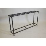 An antique wrought iron stick stand, 46" x 8", 26"high