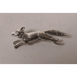 A sterling silver brooch in the form of a fox, 2" long