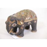 A Satsuma porcelain figure of an elephant, with enamel and gilt highlights, 8" long