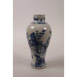 A Chinese blue and white porcelain vase decorated with women and children in a garden, marked with