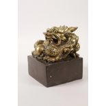 A large Chinese filled bronze seal with a dragon knop, 4" x 4"