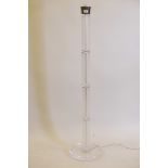 A frosted lucite and chrome floor lamp/uplighter, lacks shade, 56" high