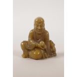 A Chinese carved soapstone lohan, 3" high