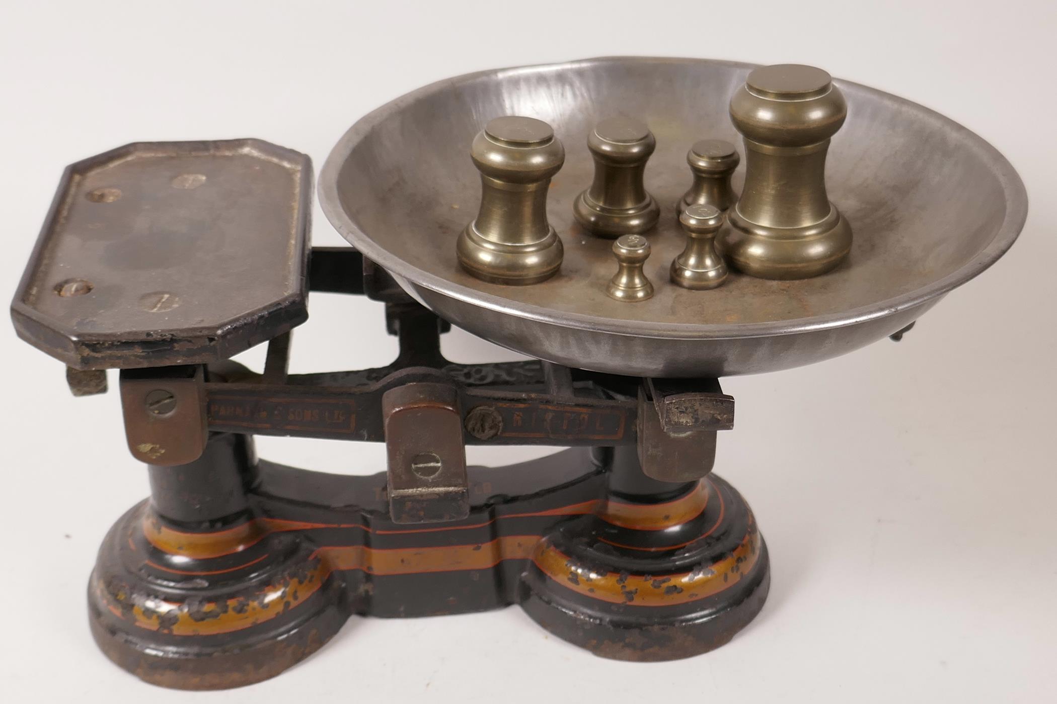 A set of cast iron kitchen scales by Parnell and Sons Ltd, Bristol, together with a set of seven