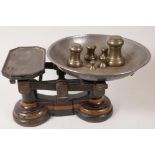 A set of cast iron kitchen scales by Parnell and Sons Ltd, Bristol, together with a set of seven
