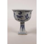 A small Chinese blue and white porcelain stem cup decorated with figures in a landscape, mark to