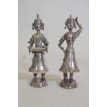 A pair of oriental low grade silver figures of a dancer and musician, 9½" high