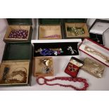 A basket of jewellery boxes and costume jewellery