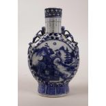 A Chinese blue and white porcelain flask with dragon handles and landscape decoration, 4 character