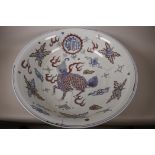 A large C19th Chinese doucai porcelain bowl, the interior decorated with chimeric creature amidst
