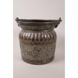 An African copper bucket with swing handle chased and embossed with lions hunting antelope, 8"