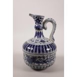 A Chinese blue and white pottery ewer decorated with a phoenix in flight and lotus flowers, 8½" high