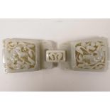 A Chinese celadon jade belt buckle with carved and pierced kylin decoration, 6½" x 2"