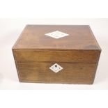 A C19th mother of pearl inlaid rosewood vanity box, the fitted interior with silver plate and