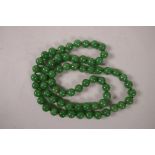 A long string of jade beads, 30" long