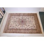 An ivory ground Kashmir rug with traditional shasafi design, 62"x 91"