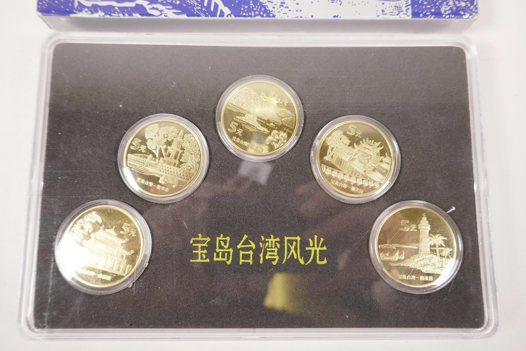 A cased collection of facsimile (replica) Chinese gilt metal coins commemorating important monuments - Image 2 of 3