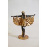 A composition Art Deco style figure of a dancer with ebonised and gilt decoration, 13½" high