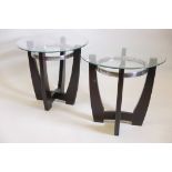 A pair of stained mahogany and chrome side tables with bevelled glass tops, 26" diameter x 24" high