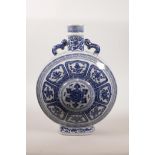 A Chinese blue and white porcelain two handled moon flask decorated with the Eight Buddhist
