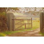 In the manner of Fred Hall, oil on canvas laid on board, view through a gate to a meadow with