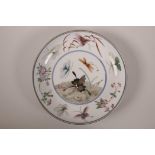 A Chinese polychrome porcelain dish with butterfly decoration, 6 character mark to base, 8½"