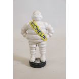 A painted cast metal figure of the Michelin Man, 15" high