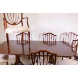 A set of six mahogany Regency style dining chairs (4+2) and a twin pedestal dining table (ex