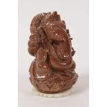 A small carved goldstone figurine of Ganesh, 4" high