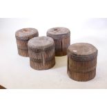 A set of four carved wood garden stools, 15" diameter x 15" high