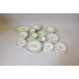 A Susie Cooper six place setting Nosegay pattern dinner service including two oval platters and