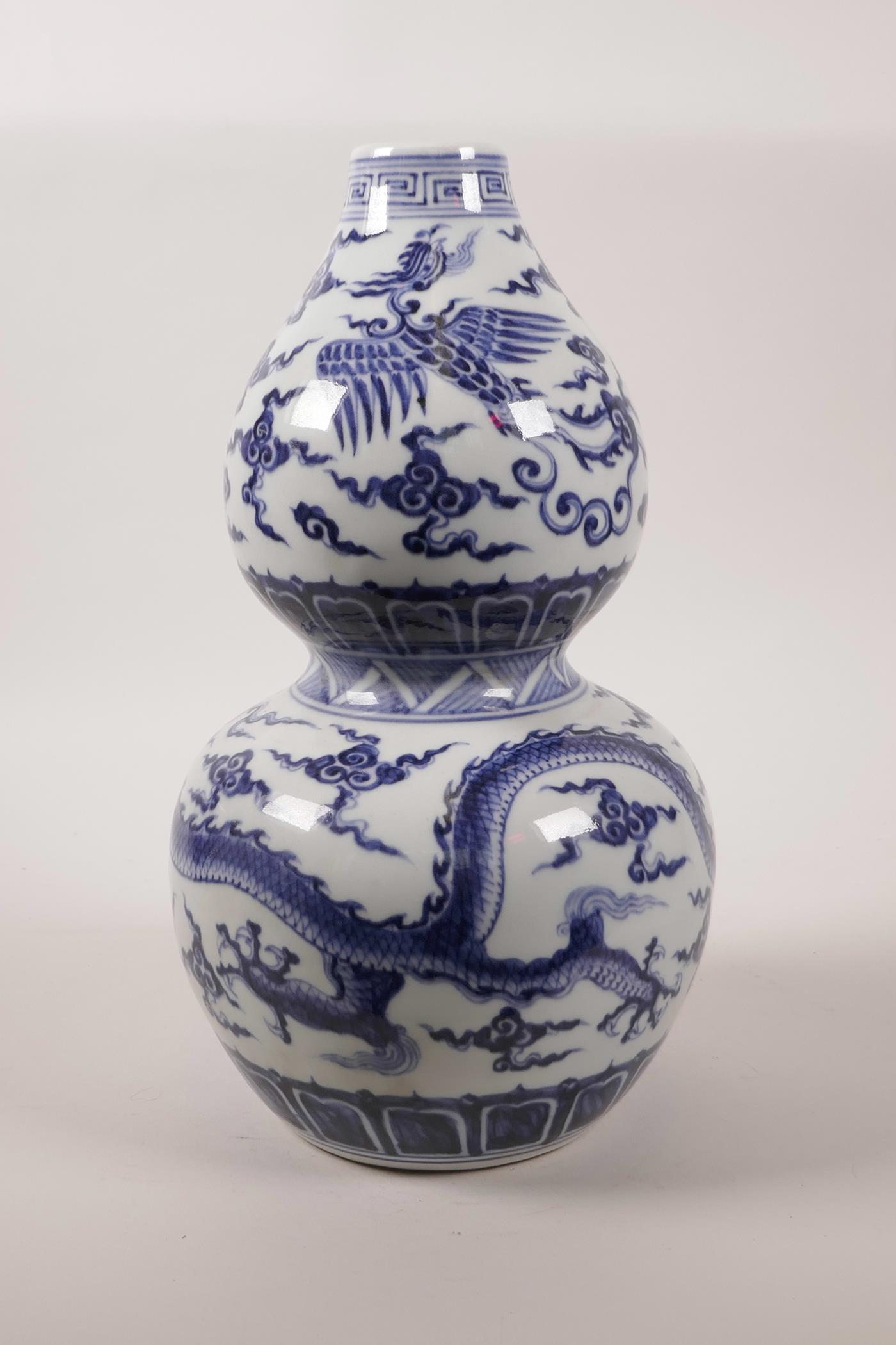 A Chinese double gourd pottery vase decorated with a dragon and phoenix in flight, 6 character - Image 3 of 6