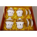 A set of four Chinese blue and white porcelain cups, covers and saucers, in presentation case