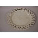 A Leeds Creamware oval ribbon plate with basket weave moulding, 10½" x 8½"