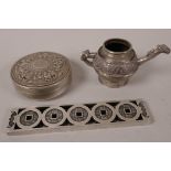 A Chinese white metal scroll weight pierced with coin symbols and engraved with bats, 6¼" long,